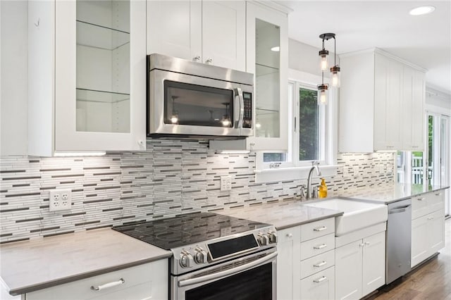 3442 Mercer Rd, Neshannock Twp, PA 16105 - kitchen featuring stainless steel appliances, tasteful backsplash, white cabinets, hanging light fixtures, and recessed lighting