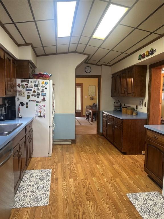 566 4th St, City Of But Ne, PA 16001 - kitchen featuring dishwasher, freestanding refrigerator, a paneled ceiling, light wood-style floors, and dark brown cabinetry
