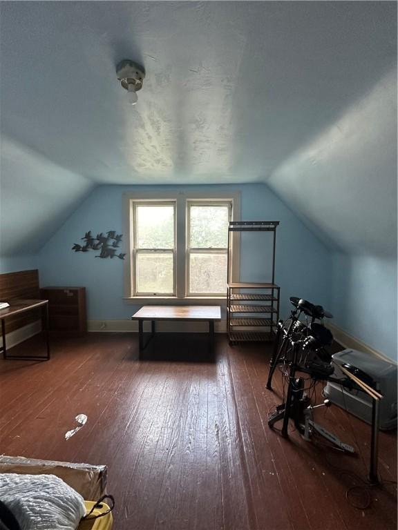 566 4th St, City Of But Ne, PA 16001 - additional living space featuring vaulted ceiling and dark wood-style flooring