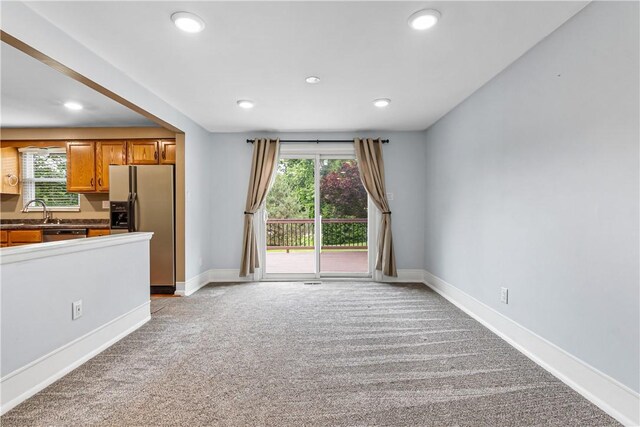 747 Thornwick Dr, Upper St Clair, PA 15243 - kitchen with appliances with stainless steel finishes, light carpet, brown cabinetry, recessed lighting, and dark countertops