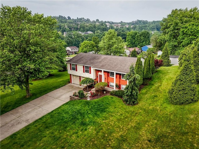 747 Thornwick Dr, Upper St Clair, PA 15243 - raised ranch featuring concrete driveway, brick siding, a front lawn, an attached garage, and roof with shingles
