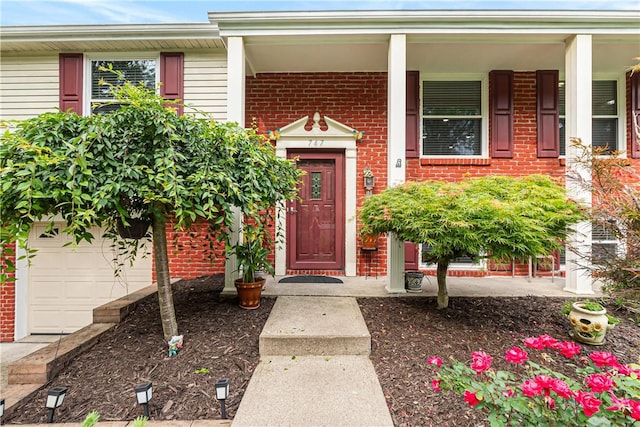 747 Thornwick Dr, Upper St Clair, PA 15243 - entrance to property featuring brick siding, a porch, and a garage