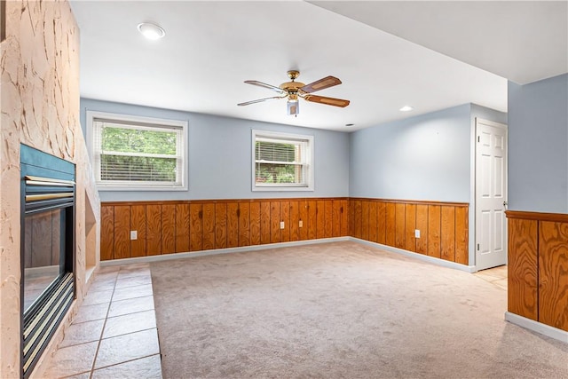 747 Thornwick Dr, Upper St Clair, PA 15243 - spare room featuring a wainscoted wall, ceiling fan, wood walls, a fireplace, and recessed lighting