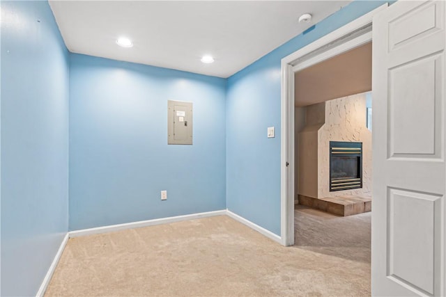 747 Thornwick Dr, Upper St Clair, PA 15243 - spare room featuring electric panel, carpet flooring, a tiled fireplace, a smoke detector, and recessed lighting