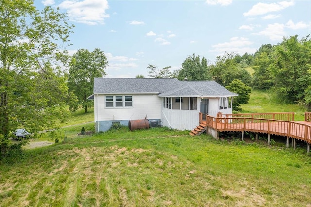 10 Fieldcrest Dr, Robinson Twp Wsh, PA 15057 - rear view of house with a wooden deck, a sunroom, a lawn, and roof with shingles