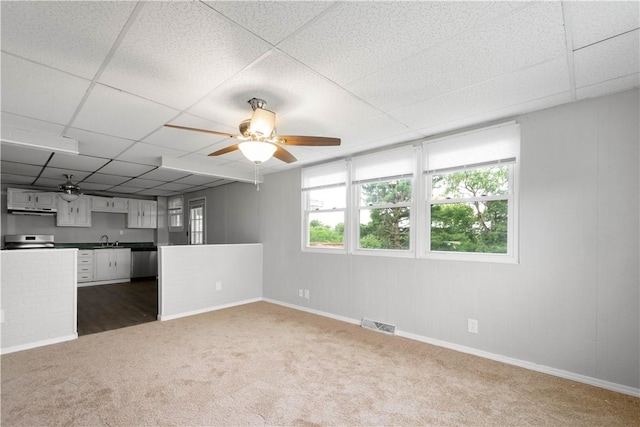 10 Fieldcrest Dr, Robinson Twp Wsh, PA 15057 - unfurnished living room featuring dark carpet, a paneled ceiling, and ceiling fan
