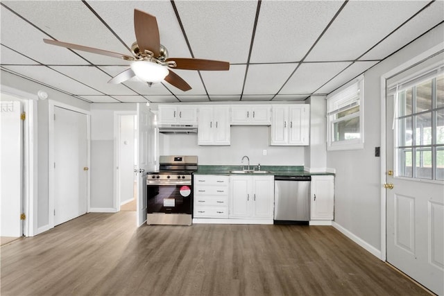 10 Fieldcrest Dr, Robinson Twp Wsh, PA 15057 - kitchen featuring stainless steel appliances, under cabinet range hood, dark wood-type flooring, ceiling fan, and white cabinets