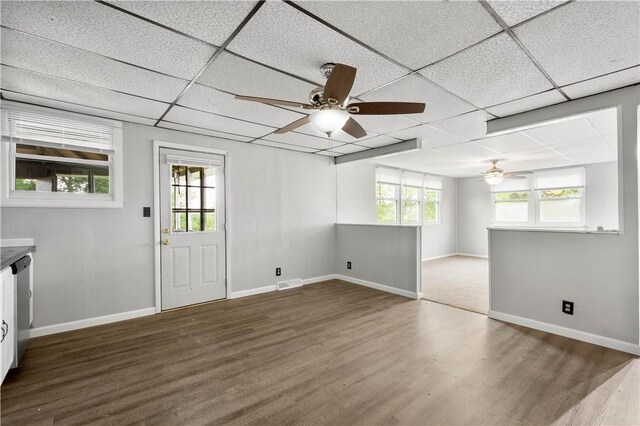 10 Fieldcrest Dr, Robinson Twp Wsh, PA 15057 - unfurnished living room with ceiling fan, a paneled ceiling, wood finished floors, and plenty of natural light
