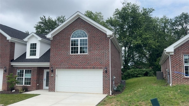 149 Shady River Blvd Unit 40B, Economy, PA 15005 - traditional home featuring brick siding, driveway, a front yard, and a garage
