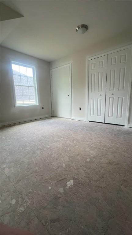 149 Shady River Blvd Unit 40B, Economy, PA 15005 - unfurnished bedroom with multiple closets and carpet floors