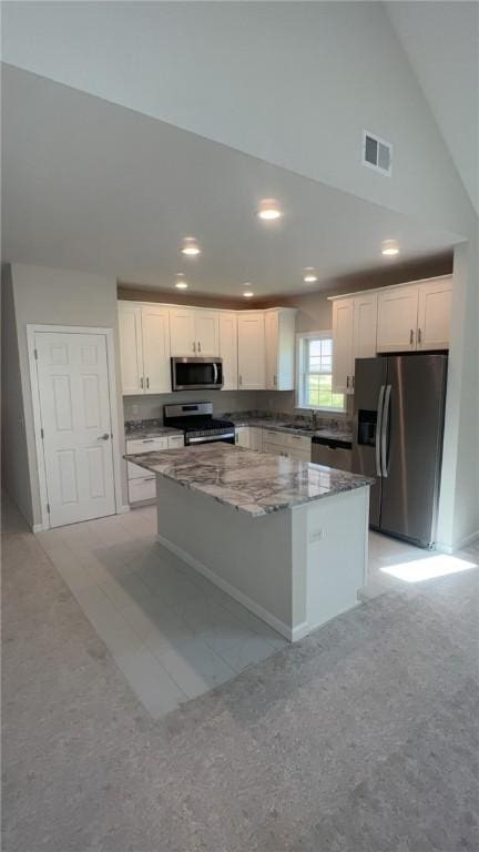 149 Shady River Blvd Unit 40B, Economy, PA 15005 - kitchen with stainless steel appliances, a kitchen island, white cabinetry, stone counters, and recessed lighting