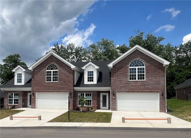 149 Shady River Blvd Unit 40B, Economy, PA 15005 - traditional-style home featuring a garage, brick siding, and driveway