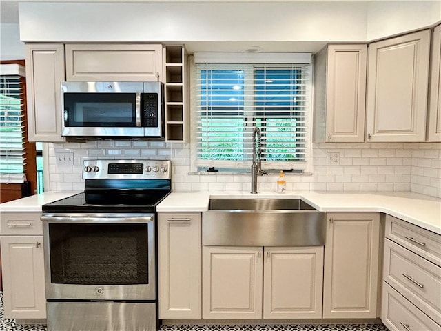 622 Fuhrman Ln, Buffalo Twp But, PA 16229 - kitchen with stainless steel appliances, decorative backsplash, and light countertops
