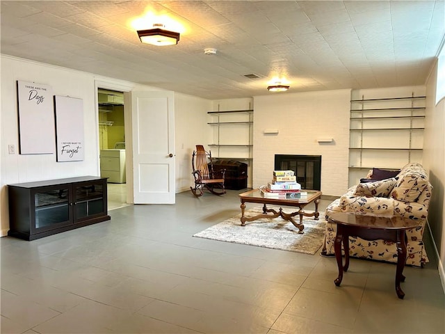 622 Fuhrman Ln, Buffalo Twp But, PA 16229 - living room featuring washer / clothes dryer, a fireplace, and built in features