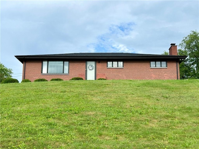 622 Fuhrman Ln, Buffalo Twp But, PA 16229 - ranch-style house featuring a chimney, brick siding, and a front yard