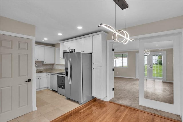 354 Ryan Dr, Pittsburgh, PA 15220 - kitchen with appliances with stainless steel finishes, a chandelier, white cabinetry, hanging light fixtures, and recessed lighting