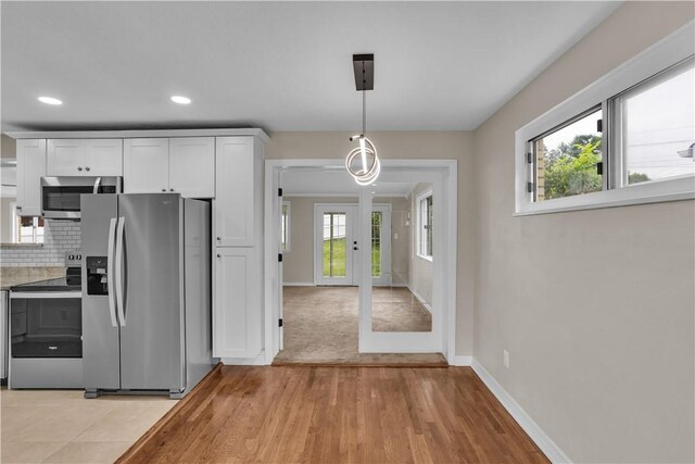 354 Ryan Dr, Pittsburgh, PA 15220 - kitchen featuring appliances with stainless steel finishes, healthy amount of natural light, white cabinets, and recessed lighting