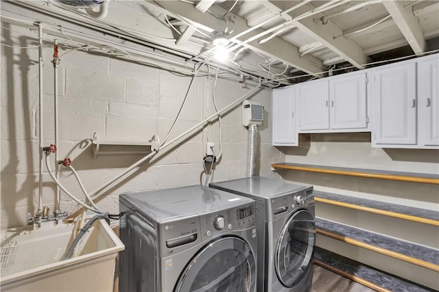 354 Ryan Dr, Pittsburgh, PA 15220 - laundry area with cabinet space, independent washer and dryer, and concrete block wall
