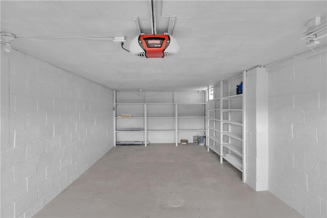 354 Ryan Dr, Pittsburgh, PA 15220 - garage featuring concrete block wall and a garage door opener