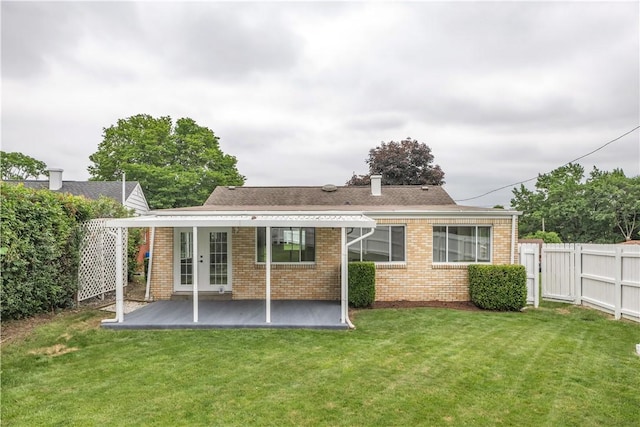 354 Ryan Dr, Pittsburgh, PA 15220 - back of house with brick siding, a patio area, a chimney, roof with shingles, and french doors
