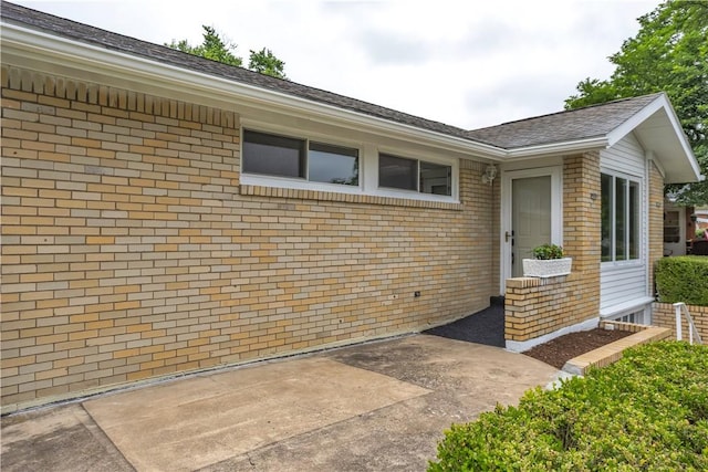 354 Ryan Dr, Pittsburgh, PA 15220 - view of exterior entry with brick siding and a patio