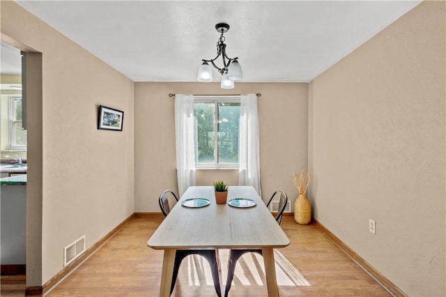 1492 Prospect Rd, Baldwin Boro, PA 15227 - dining room with light wood finished floors and a chandelier