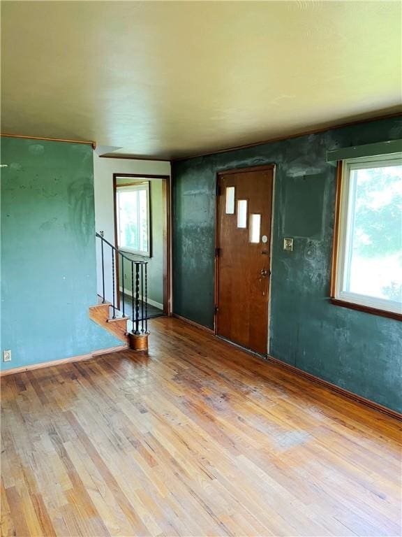 238 Humphrey Rd, Hempfield Twp Wml, PA 15601 - unfurnished room featuring wood finished floors, healthy amount of natural light, and stairway