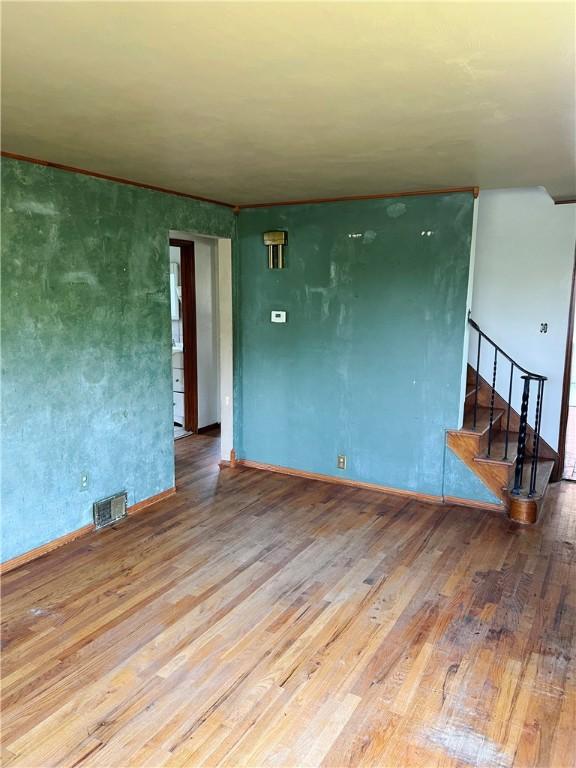 238 Humphrey Rd, Hempfield Twp Wml, PA 15601 - empty room with hardwood / wood-style flooring and stairs