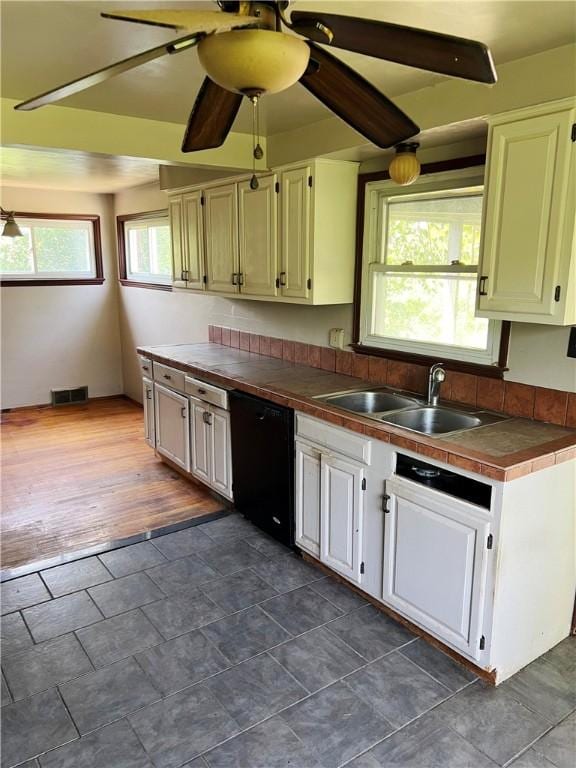238 Humphrey Rd, Hempfield Twp Wml, PA 15601 - kitchen with dishwasher, tile counters, and a ceiling fan