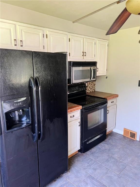 238 Humphrey Rd, Hempfield Twp Wml, PA 15601 - kitchen featuring black appliances, white cabinetry, tile patterned floors, and tasteful backsplash
