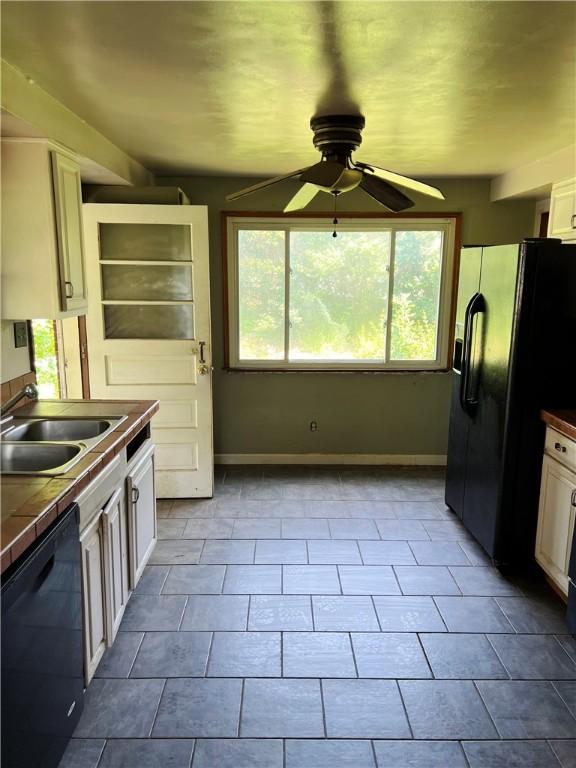238 Humphrey Rd, Hempfield Twp Wml, PA 15601 - kitchen featuring black appliances, tile countertops, a ceiling fan, and plenty of natural light
