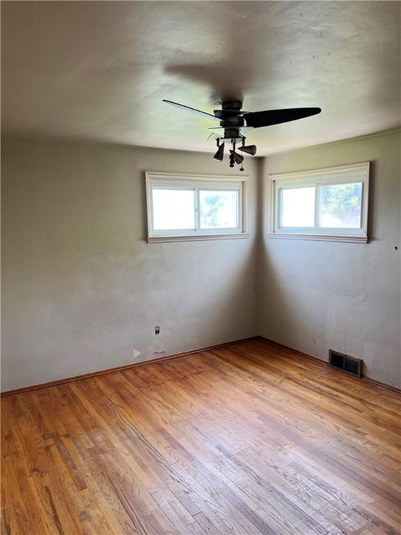 238 Humphrey Rd, Hempfield Twp Wml, PA 15601 - empty room with wood finished floors and a ceiling fan