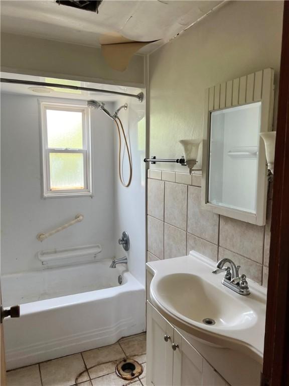 238 Humphrey Rd, Hempfield Twp Wml, PA 15601 - full bath featuring vanity,  shower combination, tile patterned floors, and tile walls