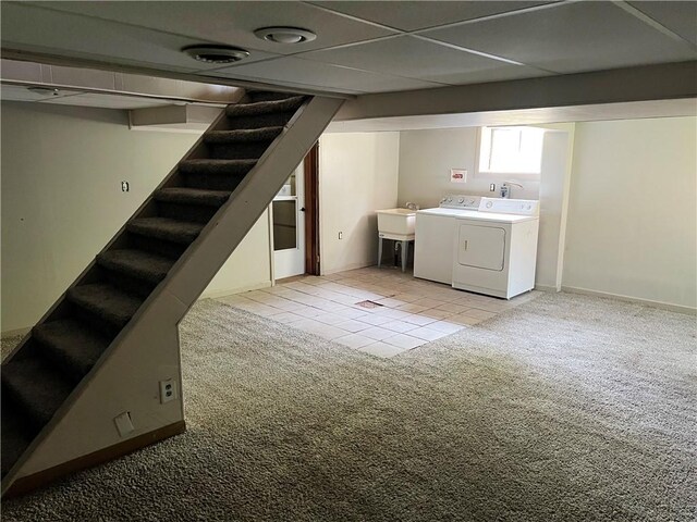 238 Humphrey Rd, Hempfield Twp Wml, PA 15601 - basement with light colored carpet, stairway, washer and dryer, and light tile patterned floors
