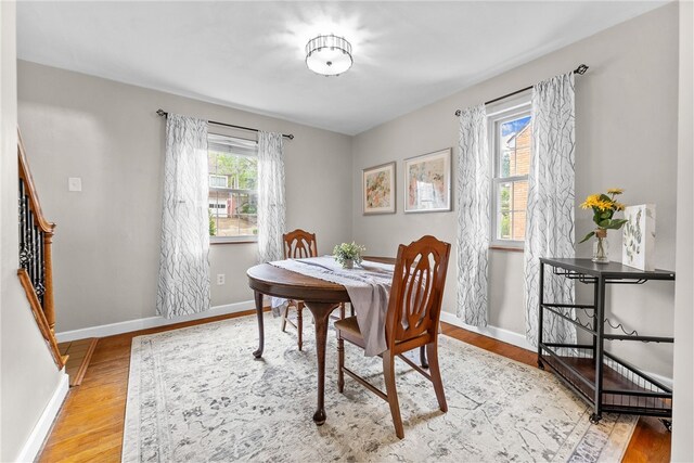 1406 Blossom Hill Rd, Castle Shannon, PA 15234 - dining space with light wood-style flooring and stairs
