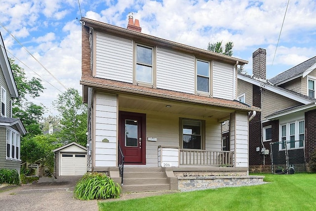 206 Lincoln Ave, Edgewood, PA 15218 - view of front facade with a chimney, covered porch, an outbuilding, a detached garage, and driveway