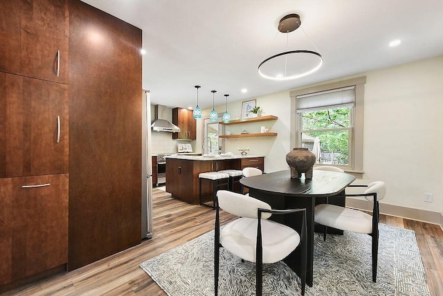 206 Lincoln Ave, Edgewood, PA 15218 - dining room featuring light wood-type flooring and baseboards