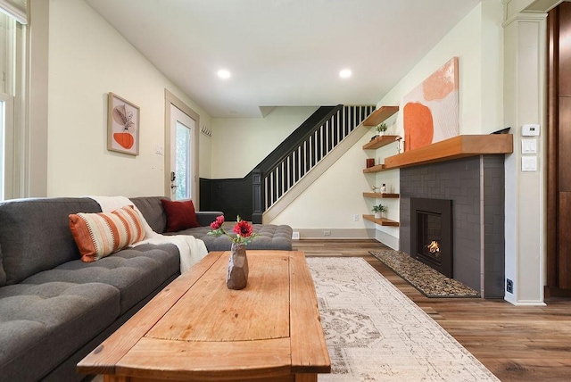 206 Lincoln Ave, Edgewood, PA 15218 - living area with wood finished floors, stairs, recessed lighting, and a fireplace