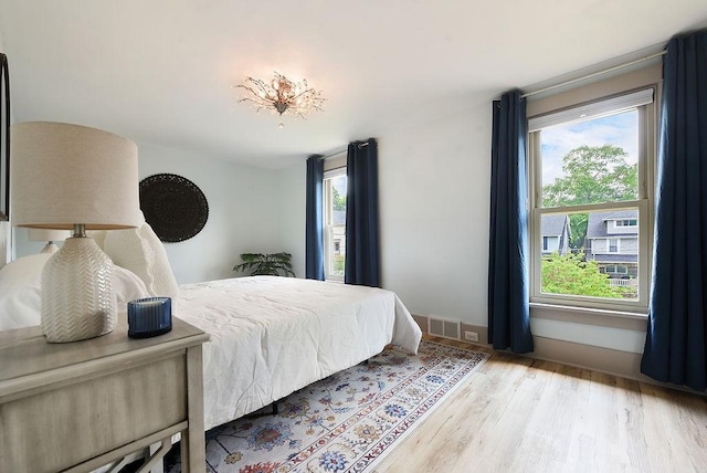 206 Lincoln Ave, Edgewood, PA 15218 - bedroom featuring multiple windows and wood finished floors