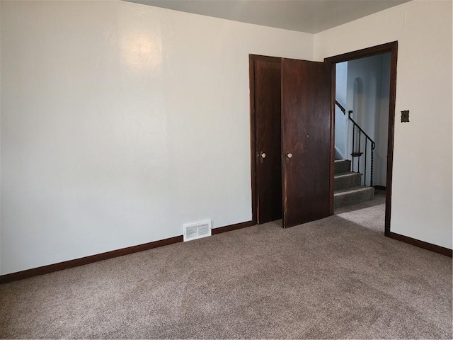 1025 Union Ave, Brackenridge, PA 15014 - carpeted spare room with baseboards and stairway