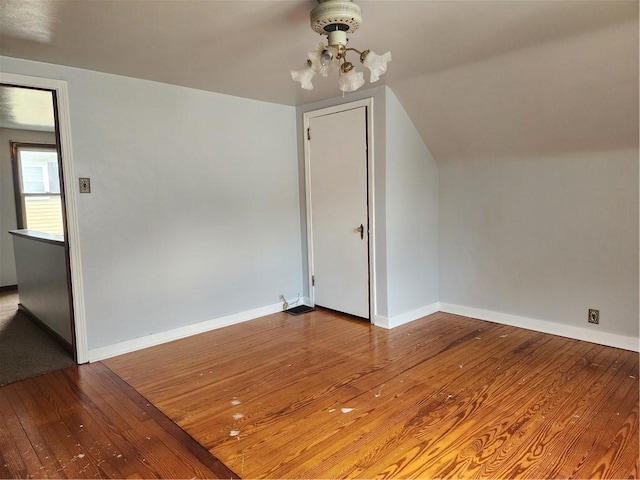 1025 Union Ave, Brackenridge, PA 15014 - additional living space with hardwood / wood-style flooring, a chandelier, and vaulted ceiling