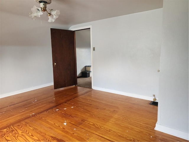 1025 Union Ave, Brackenridge, PA 15014 - spare room featuring wood-type flooring and a chandelier