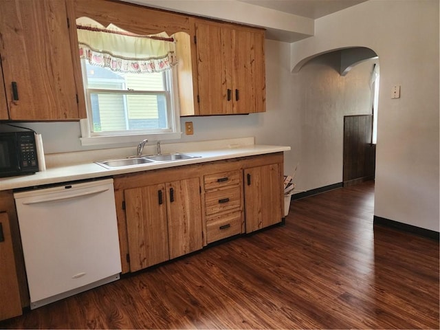 1025 Union Ave, Brackenridge, PA 15014 - kitchen featuring dishwasher, black microwave, light countertops, dark wood-style floors, and arched walkways