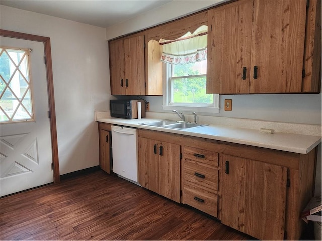 1025 Union Ave, Brackenridge, PA 15014 - kitchen featuring white dishwasher, black microwave, light countertops, brown cabinetry, and dark wood-type flooring