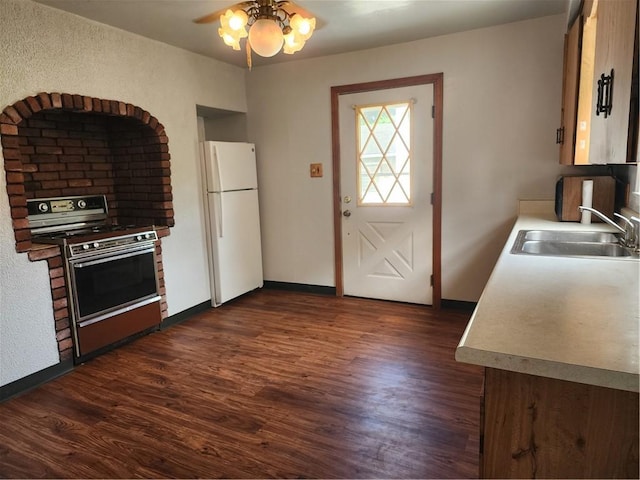 1025 Union Ave, Brackenridge, PA 15014 - kitchen featuring electric stove, freestanding refrigerator, ceiling fan, and dark wood-type flooring