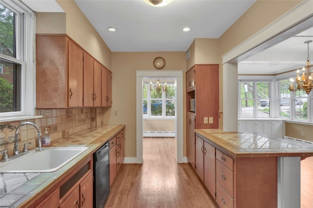 5256 Beeler St, Squirrel Hill, PA 15217 - kitchen with a baseboard heating unit, tile countertops, dishwasher, and a chandelier