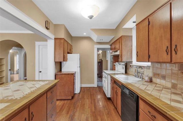 5256 Beeler St, Squirrel Hill, PA 15217 - kitchen with tile countertops, white appliances, decorative backsplash, and light wood-style flooring
