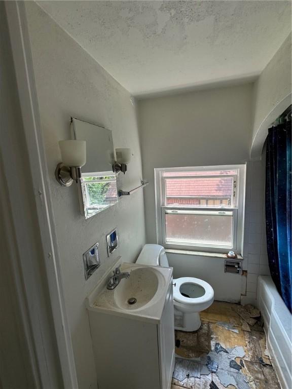2205 Chalfant St, Chalfant Boro, PA 15221 - full bath with vanity, stone finish flooring, and shower / tub combo with curtain