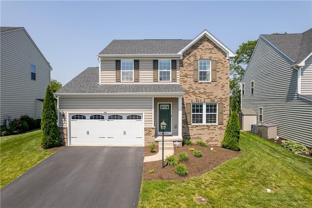 265 Sunrise Dr, Collier Twp, PA 15106 - view of front facade with asphalt driveway, brick siding, a front yard, a garage, and a shingled roof