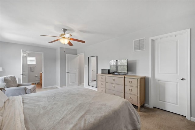 265 Sunrise Dr, Collier Twp, PA 15106 - bedroom with light colored carpet, a ceiling fan, and connected bathroom